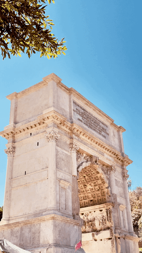 Arch of Constantine in Rome, Italy, an ancient Roman triumphal arch featuring ornate stone carvings and detailed reliefs near the Colosseum