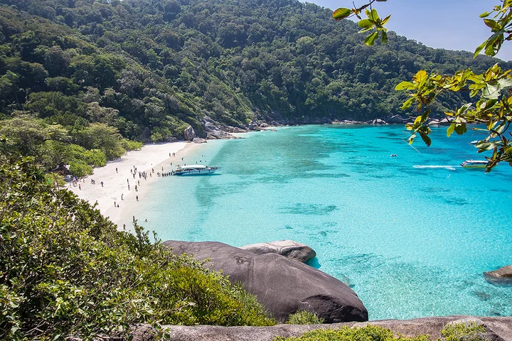 Khao Lak With Kids: Where To Stay, Eat & Best Things To Do Similan Islands Thailand with white sandy beach turquoise water and lush green tropical hills in the Andaman Sea near Khao Lak