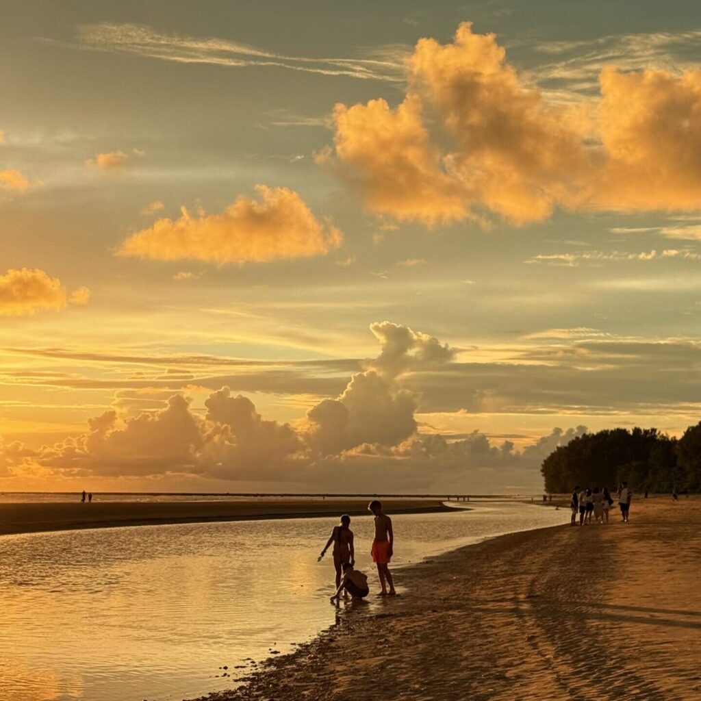 Family Sunsetview at Khao Lak, Thailand with wooden swing and golden sky