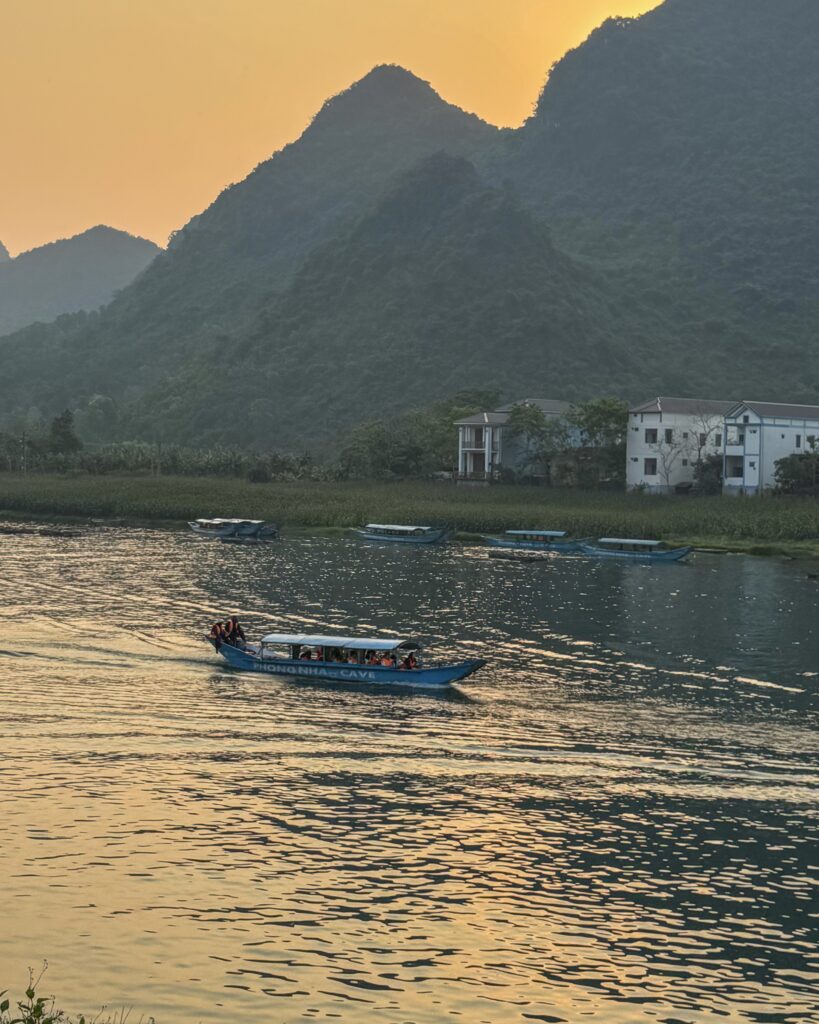 Phong Nha With Kids: Where To Stay, Eat & The Best Things To Do Sunset over the mountains and river in Phong Nha, Vietnam