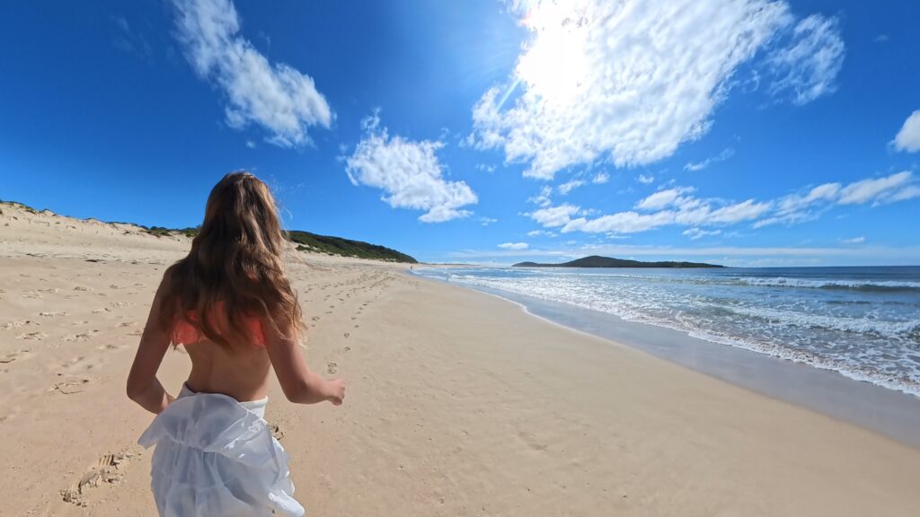 Family friendly beach at Fingal Bay, Port Stephens NSW, with golden sand, ocean views and a beautiful stretch of coastline for kids to explore