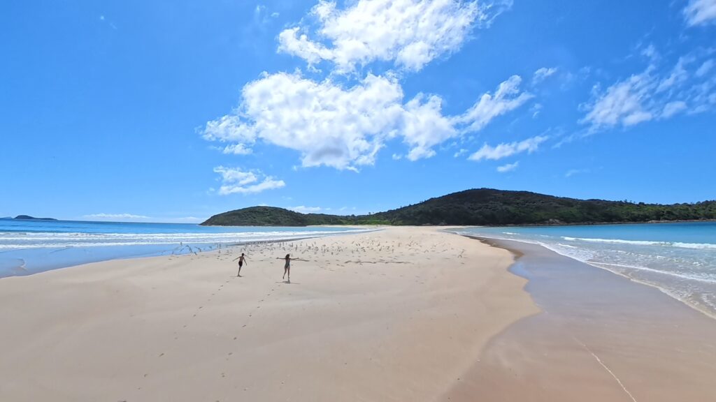 Fingal Bay sandbar in Port Stephens NSW with sweeping white sand, crystal clear water and stunning coastal views popular with families visiting the NSW coast