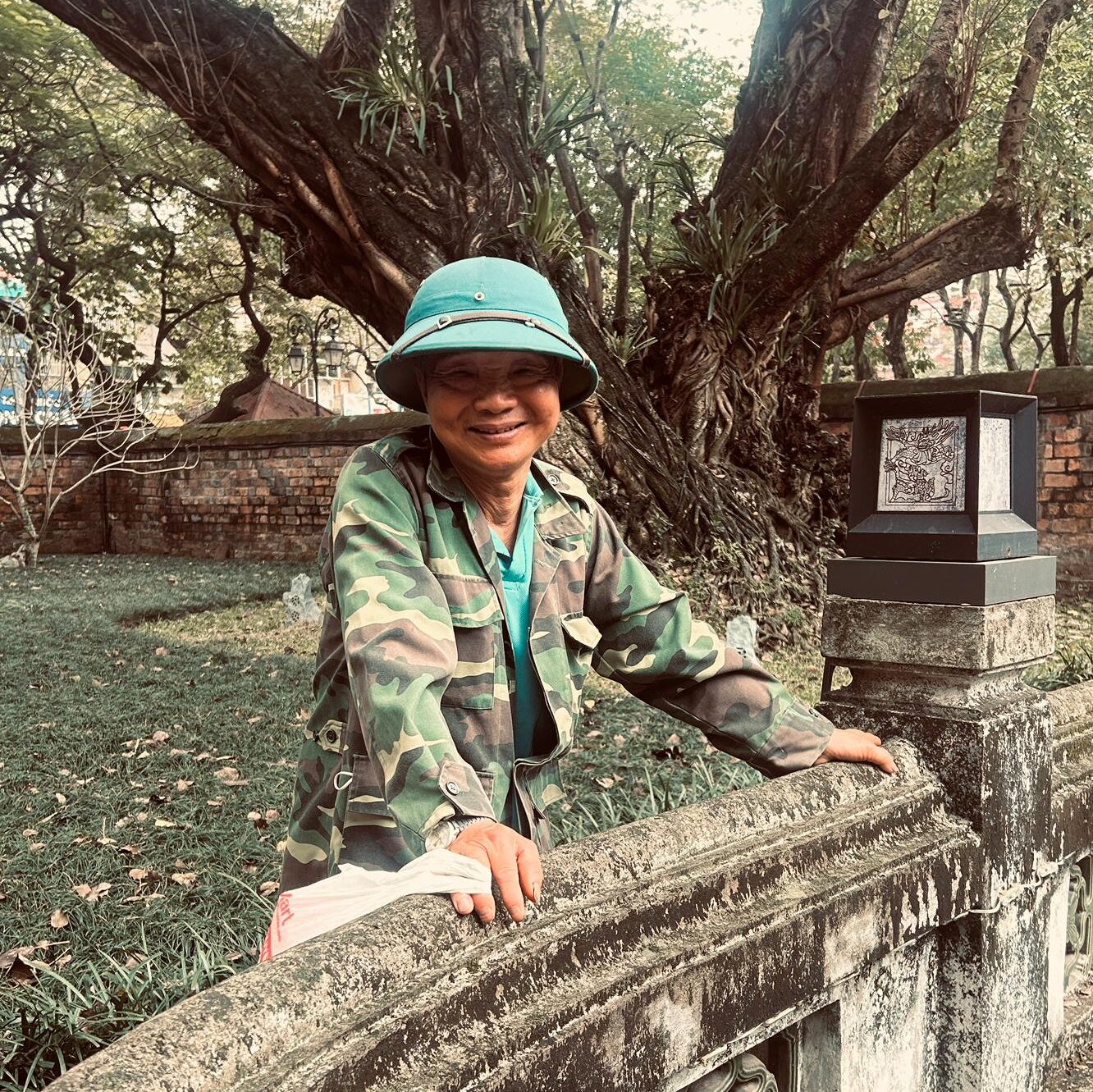 Woman visiting a historic temple in Hanoi, Vietnam