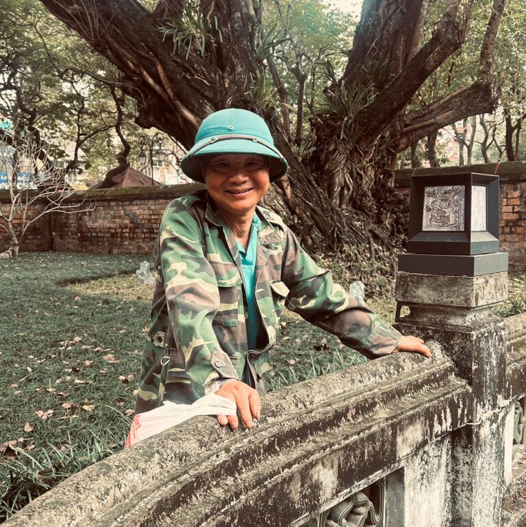 Woman visiting a historic temple in Hanoi, Vietnam