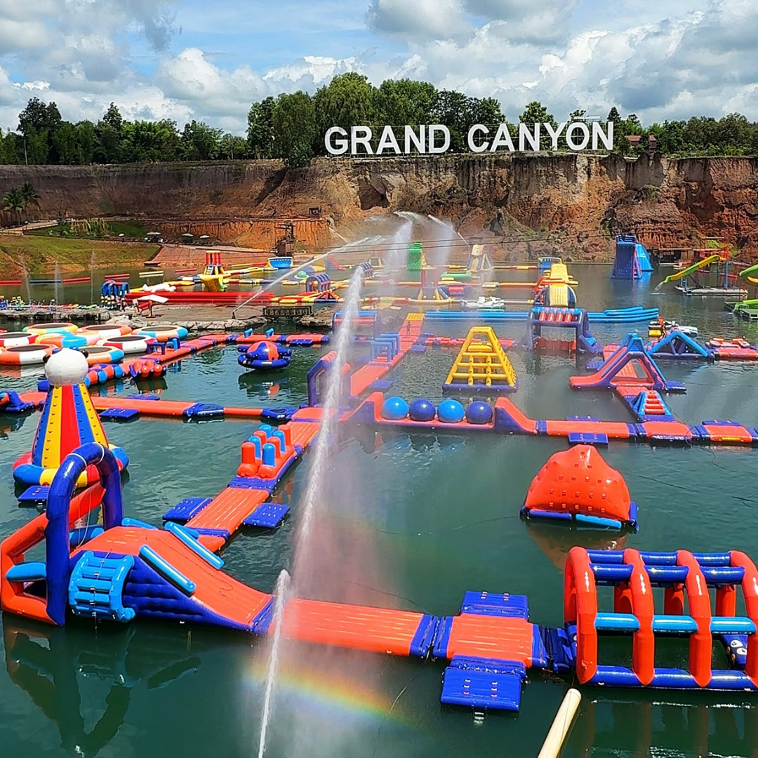 Grand Canyon Water Park in Chiang Mai, Thailand, with a giant inflatable floating obstacle course for family fun and swimming